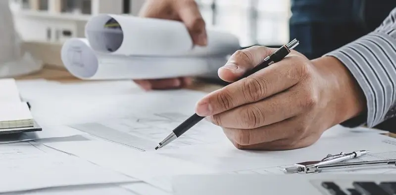 Engineer reviewing aluminum alloy selection for CNC machining
